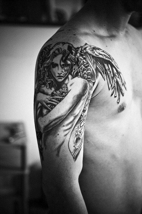 Wings Tattoo On Right Shoulder