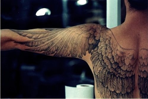 Grey Ink Wings Tattoos On Back And Left Sleeve