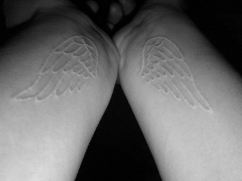 White ink Wings Tattoos