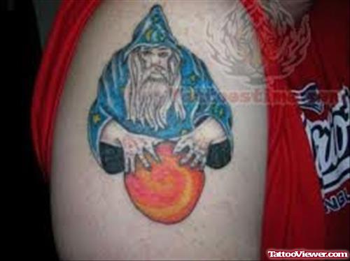 Blue Ink Wizard Tattoo On Bicep