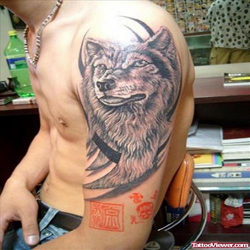 Black Tribal And Wolf Head Tattoo On Left Half Sleeve