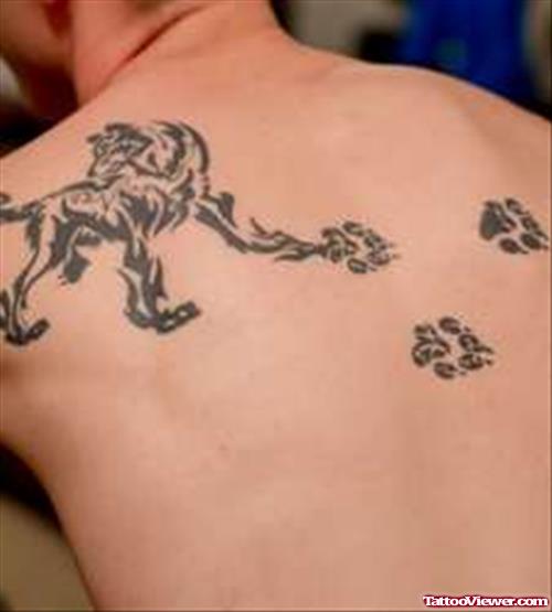 Paw Prints and Wolf Tattoo On Back