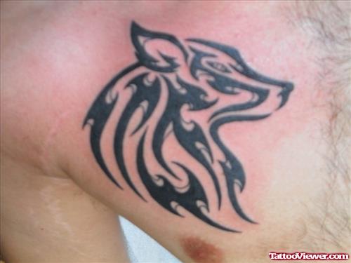 Awesome Black Tribal Wolf Tattoo On Man Chest