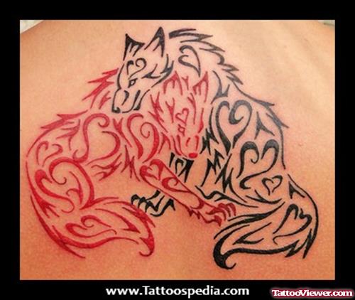 Red And Black Tribal Wolf Tattoo On Right Shoulder