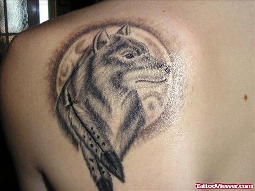 Grey Ink Feathers And Wolf Head Tattoo On Left Back Shoulder