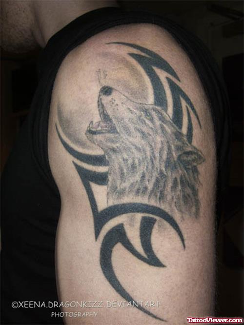 Black Tribal And Howling Wolf Tattoo On Left Half Sleeve