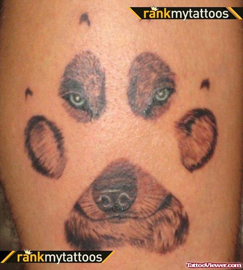 Grey Ink Paw Prints And Wolf Head Tattoo