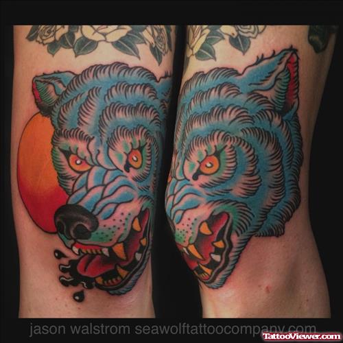 Blue Ink Wolf Head Tattoo