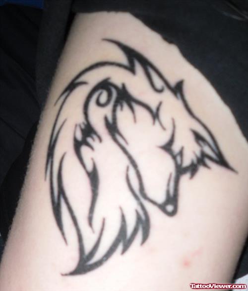 Black Tribal Wolf Tattoo On Bicep