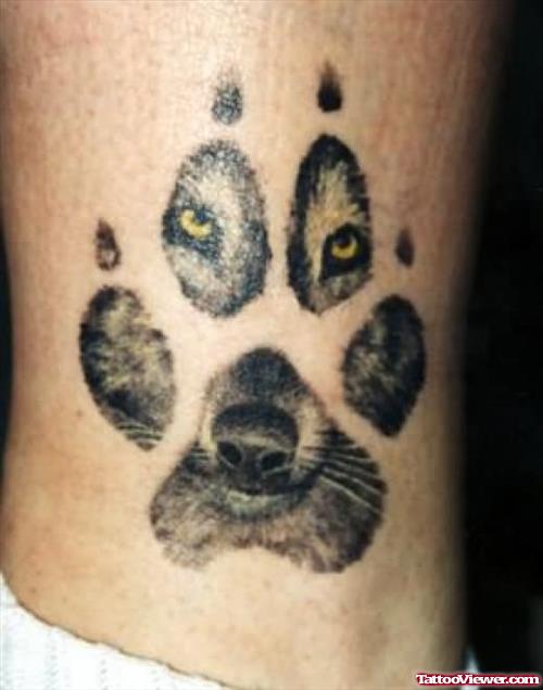 Cool Wolf Looking Throgh Paw Tattoo