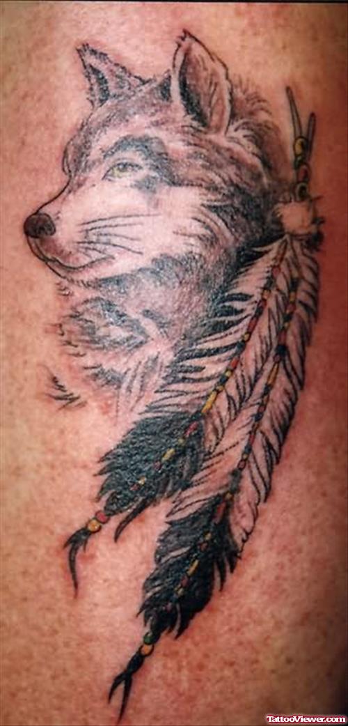 Amazing Wolf And Feathers Tattoo
