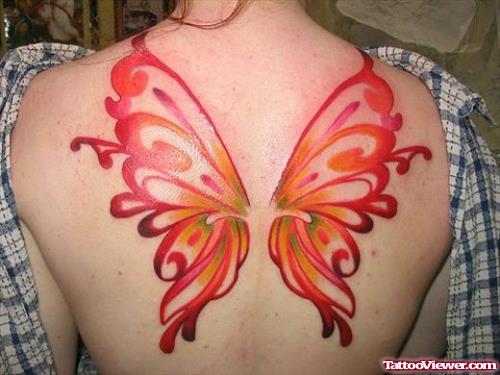Colored Tribal Butterfly Tattoo On Back For Women