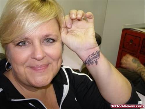 Forgiven Word Tattoo On Women Left Wrist