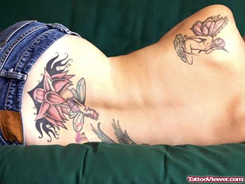 Lotus Flower And Fairies Tattoos On Back For Women
