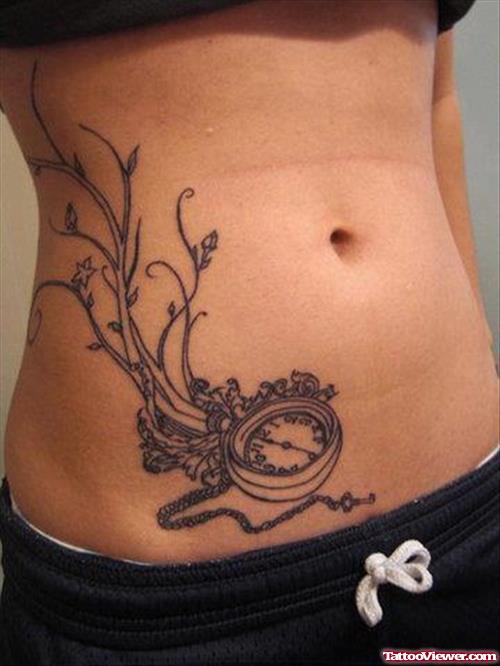 Grey Ink Clock Hip Tattoo For Women
