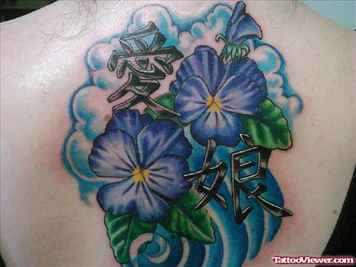 Blue Flowers And Kanji Symbol Tattoo On Back For Women