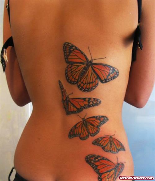 Colored Flying Butterflies Women Tattoo On Back