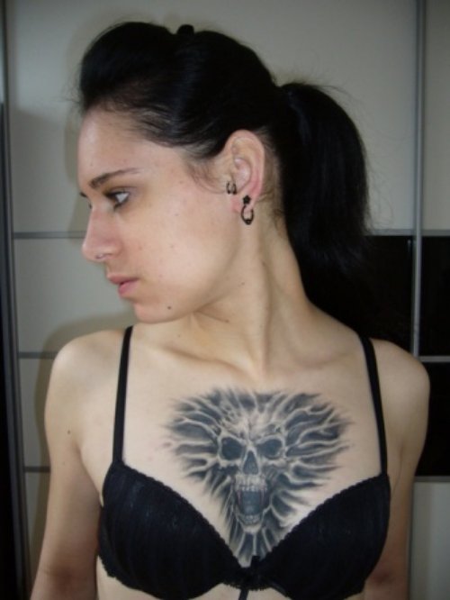 Grey Ink Skull Chest Tattoo For Women