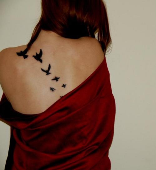 Black Ink Flying Birds Tattoos On Back For Women