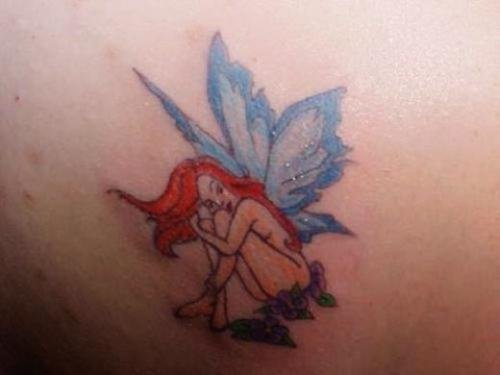 Colored Ink Fairy Women Tattoo On Back