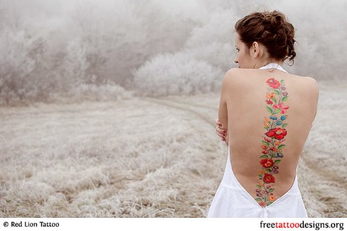 Awesome Colored Flowers Women Tattoo On Back