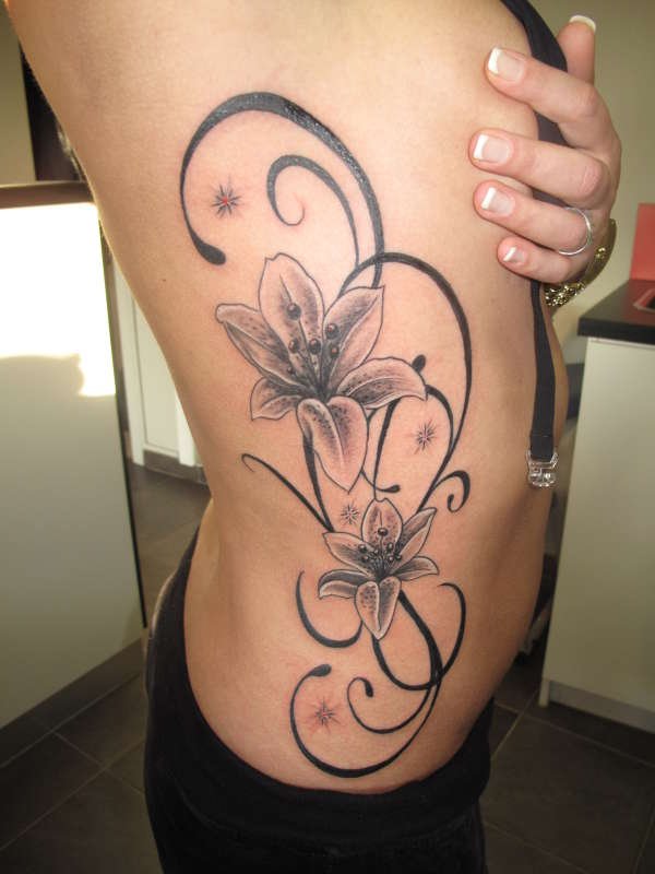 Tribal And Grey Flowers Woman Tattoo