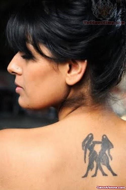 Beautiful Girl With Gemini Tattoo on Back