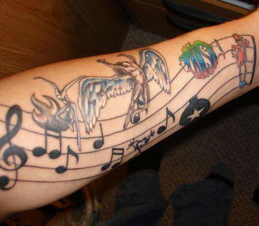 Music Notes Graffiti Tattoo On Left Forearm